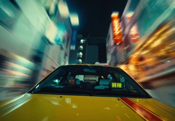 Movie still from “AJ Tracey - Wifey Riddim 4” (2024), directed by Late Milk – Wide shot, Low angle