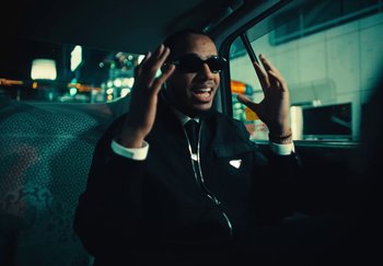 Movie still from “AJ Tracey - Wifey Riddim 4” (2024), directed by Late Milk – Close Up shot, Low angle