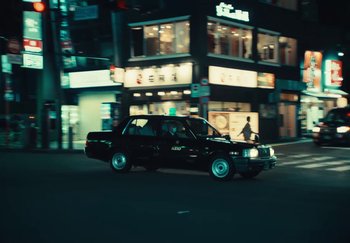 Movie still from “AJ Tracey - Wifey Riddim 4” (2024), directed by Late Milk – Wide shot, Low angle