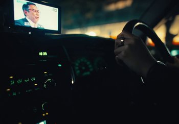 Movie still from “AJ Tracey - Wifey Riddim 4” (2024), directed by Late Milk – Extreme Close Up shot, Over the shoulder angle