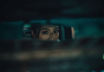 Movie still from “AJ Tracey - Wifey Riddim 4” (2024), directed by Late Milk – Extreme Close Up shot, Over the shoulder angle