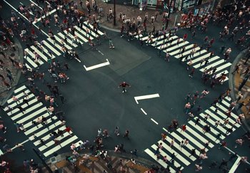 Movie still from “AJ Tracey - Wifey Riddim 4” (2024), directed by Late Milk – Extreme Wide shot, Overhead angle