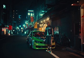 Movie still from “AJ Tracey - Wifey Riddim 4” (2024), directed by Late Milk – Wide shot, Low angle