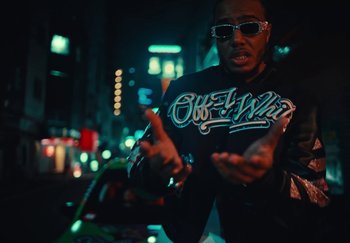 Movie still from “AJ Tracey - Wifey Riddim 4” (2024), directed by Late Milk – Medium shot, Low angle