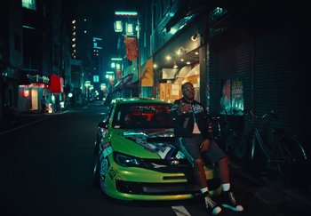 Movie still from “AJ Tracey - Wifey Riddim 4” (2024), directed by Late Milk – Wide shot, Low angle