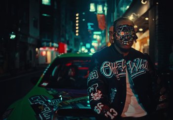 Movie still from “AJ Tracey - Wifey Riddim 4” (2024), directed by Late Milk – Medium shot, Low angle