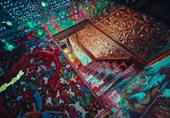 Movie still from “AJ Tracey - Wifey Riddim 4” (2024), directed by Late Milk – Extreme Close Up shot, Overhead angle