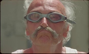 Movie still from “Nu Genea with Célia Kameni - Marechià” (2021), directed by Guido Lombardi – Close Up shot, Low angle