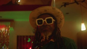 Movie still from “Valaire feat. Alan Prater - (She's a) Winner” (2023), directed by Vallée Duhamel – Close Up shot, Low angle