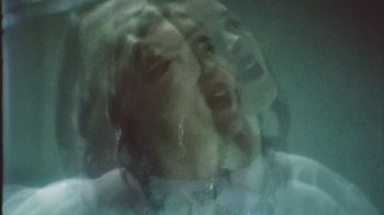 Movie still from “Lolo Zouaï - Moi + Look at Us” (2020), directed by Piotr Lebryk – Extreme Close Up shot, Overhead angle