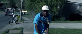 Movie still from “Tyler, The Creator - Who Dat Boy” (2017), directed by Tyler Okonma – Medium shot, Low angle
