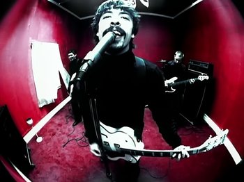 Movie still from “Foo Fighters - Monkey Wrench” (2009), directed by Dave Grohl – Medium shot, Overhead angle