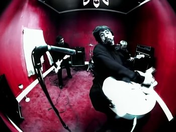 Movie still from “Foo Fighters - Monkey Wrench” (2009), directed by Dave Grohl – Medium shot, Low angle