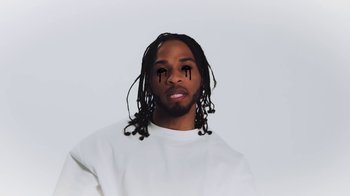 Movie still from “Armani White - BILLIE EILISH.” (2022), directed by Davey Robinson – Extreme Close Up shot, Low angle