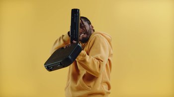 Movie still from “Armani White - BILLIE EILISH.” (2022), directed by Davey Robinson – Medium shot, Low angle