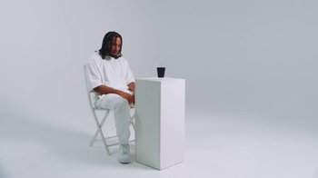 Movie still from “Armani White - BILLIE EILISH.” (2022), directed by Davey Robinson – Medium shot, Low angle