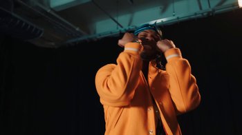 Movie still from “Armani White - BILLIE EILISH.” (2022), directed by Davey Robinson – Medium shot, Low angle