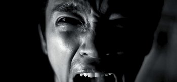 Movie still from “The Bar Stool Preachers - Lighthouse Keeper” (2023), created by Ben Hannah – Extreme Close Up shot, Low angle