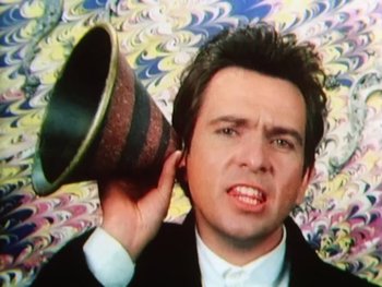 Movie still from “Peter Gabriel - Sledgehammer” (1986), directed by Stephen R. Johnson – Close Up shot, Low angle