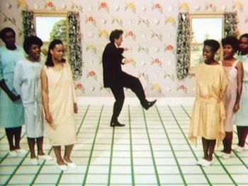 Movie still from “Peter Gabriel - Sledgehammer” (1986), directed by Stephen R. Johnson – Wide shot, Low angle