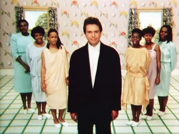 Movie still from “Peter Gabriel - Sledgehammer” (1986), directed by Stephen R. Johnson – Medium shot, Low angle