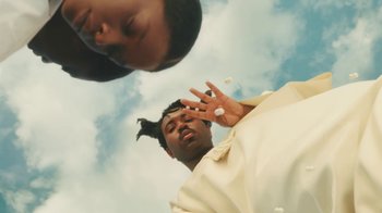 Movie still from “Sampha - Satellite Business” (2023) – Close Up shot, Low angle