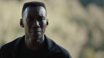 Movie still from “True Detective” (2014), created by Issa López – A person wearing a black shirt; Close Up shot, Low angle