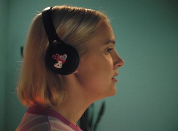 Movie still from “Carlota Flâneur - See You Again” (2021), directed by Carles Pons Altimira – Close Up shot, Low angle