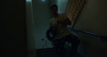 Movie still from “Maisie Peters - Psycho” (2021), directed by LOUIS BHOSE – Medium shot, Low angle