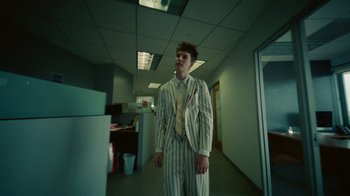 Movie still from “Gus Dapperton - Palms feat. Channel Tres” (2021), directed by Kevin Lombardo – Medium shot, Low angle