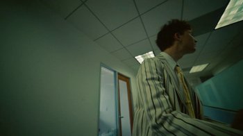 Movie still from “Gus Dapperton - Palms feat. Channel Tres” (2021), directed by Kevin Lombardo – Medium shot, Low angle