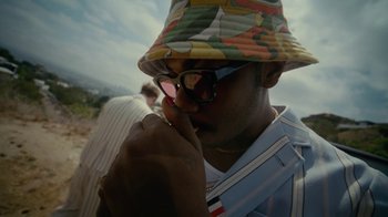Movie still from “Gus Dapperton - Palms feat. Channel Tres” (2021), directed by Kevin Lombardo – Close Up shot, Low angle