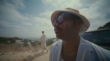Movie still from “Gus Dapperton - Palms feat. Channel Tres” (2021), directed by Kevin Lombardo – Close Up shot, Low angle