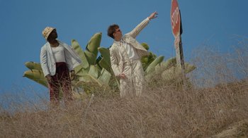 Movie still from “Gus Dapperton - Palms feat. Channel Tres” (2021), directed by Kevin Lombardo – Medium shot, Low angle