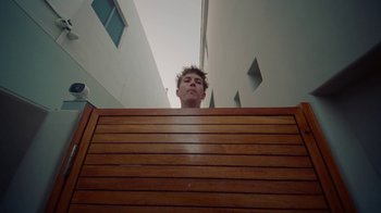 Movie still from “Gus Dapperton - Palms feat. Channel Tres” (2021), directed by Kevin Lombardo – Medium shot, Low angle