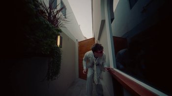 Movie still from “Gus Dapperton - Palms feat. Channel Tres” (2021), directed by Kevin Lombardo – Medium shot, Low angle