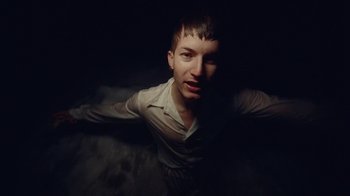 Movie still from “Gus Dapperton - Palms feat. Channel Tres” (2021), directed by Kevin Lombardo – Medium shot, High angle