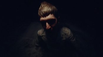 Movie still from “Gus Dapperton - Palms feat. Channel Tres” (2021), directed by Kevin Lombardo – Medium shot, High angle