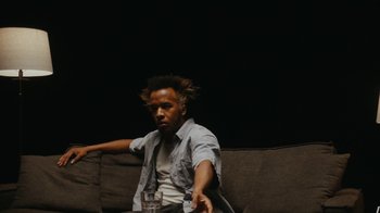 Movie still from “Cautious Clay - Wildfire” (2021), directed by Colin Read – Medium shot, Over the shoulder angle