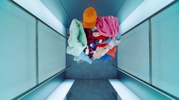 Movie still from “Halfprice - Fitting room” (2022) – Extreme Close Up shot, Overhead angle