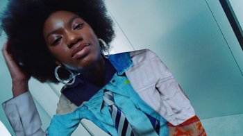 Movie still from “Halfprice - Fitting room” (2022) – Medium shot, Low angle