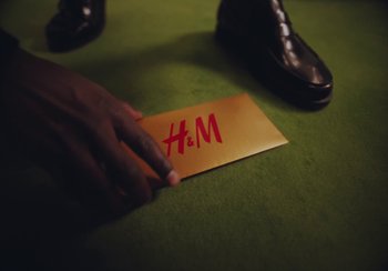 Movie still from “H&M - House of Members” (2023) – Extreme Close Up shot, Overhead angle