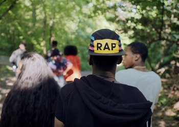 Movie still from “J. Cole - #LoveYourz” (2018) – Medium shot, Over the shoulder angle