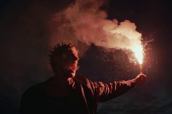 Movie still from “Alpha Industries - Made for Heroes, Worn by Icons” (2024) – Medium shot, Low angle