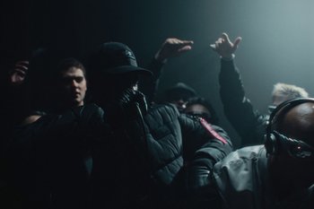 Movie still from “Alpha Industries - Made for Heroes, Worn by Icons” (2024) – Medium shot, Low angle