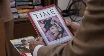 Movie still from “Trumbo” (2015), directed by Jay Roach – A person holding up an old time time magazine; Extreme Close Up shot, Overhead angle