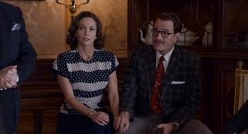 Movie still from “Trumbo” (2015), directed by Jay Roach – A man and a woman sitting next to each other; Medium shot, Over the shoulder angle
