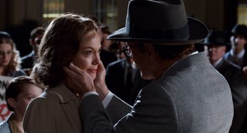 Movie still from “Trumbo” (2015), directed by Jay Roach – An older man touching a young woman's face; Close Up shot, Over the shoulder angle