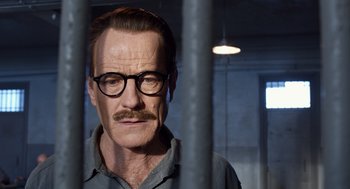 Movie still from “Trumbo” (2015), directed by Jay Roach – A person with a beard and glasses; Close Up shot, Low angle