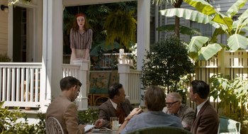 Movie still from “Trumbo” (2015), directed by Jay Roach – A group of people sitting around a table; Wide shot, Over the shoulder angle